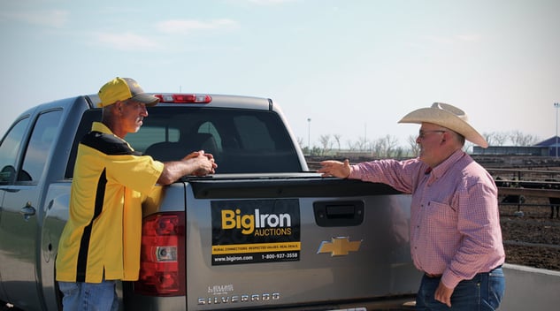 Bigiron auctions sales rep with seller - copyright-bigiron-auctions